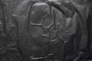 transparent plastic bag wrap overlay texture on black background