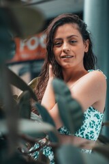 Portrait of a Caucasian female wearing a two-piece sleeveless dress in a mall