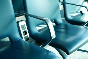 Airport charging station, Airport terminal waiting chairs featuring plug outlets and USB ports