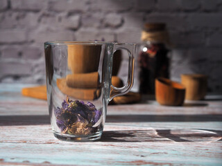Glass mug with dry flower tea