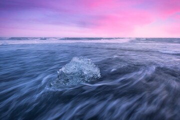 Long exposure sea waves with pinky sky in the background