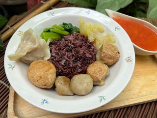 Brown rices, meat ball and yulk with red sauce