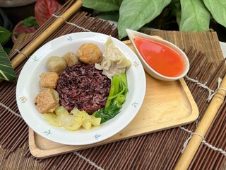 Brown rices, meat ball and yulk with red sauce