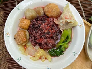 Brown rices, meat ball and yulk with red sauce