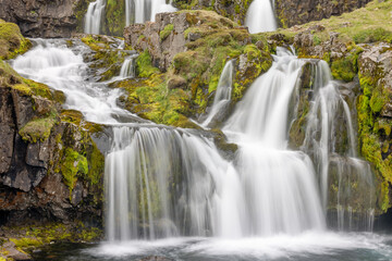 View at Kirkjufellsfoss cascade waterfall, popular tourist spot,Iceland