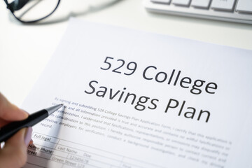 529 College Savings Plan Form With Small Graduation Hat