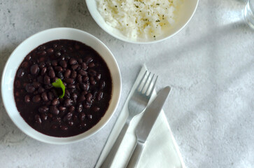 Black beans and white rice, top view.