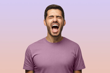 Closeup portrait of screaming with closed eyes crazy young male isolated on purple background