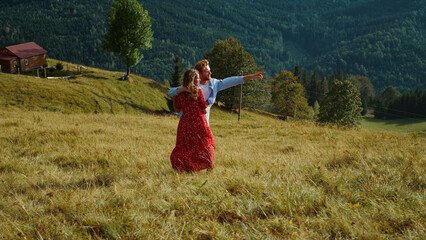 Romantic couple walk mountains nature outdoors. Happy family enjoy summer travel