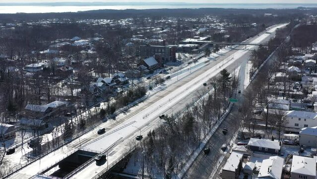 A highway next to houses covered with snow in Staten Island New York