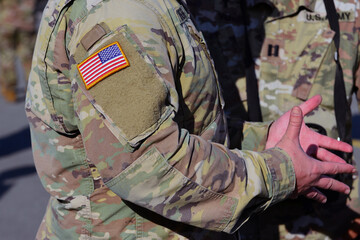United States flag attached to the US army military uniform.