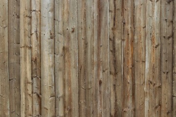 Background, texture of a wooden fence from old weathered gray boards