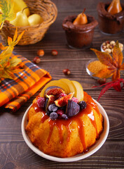 Delicious homemade autumn cake with figs and frozen berries for celebrating Thanksgiving day or...