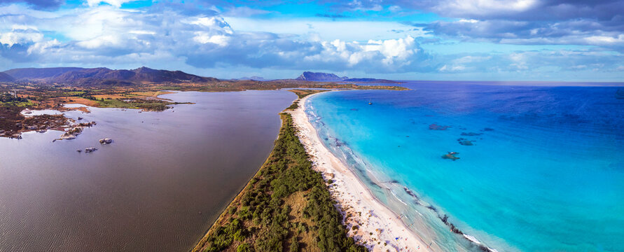 Italy. Sardegnia island nature scenery and best beaches. Aerial drone panoramic view of stunning La Cinta beach (San Teodoro) with turquoise sea and sault lake