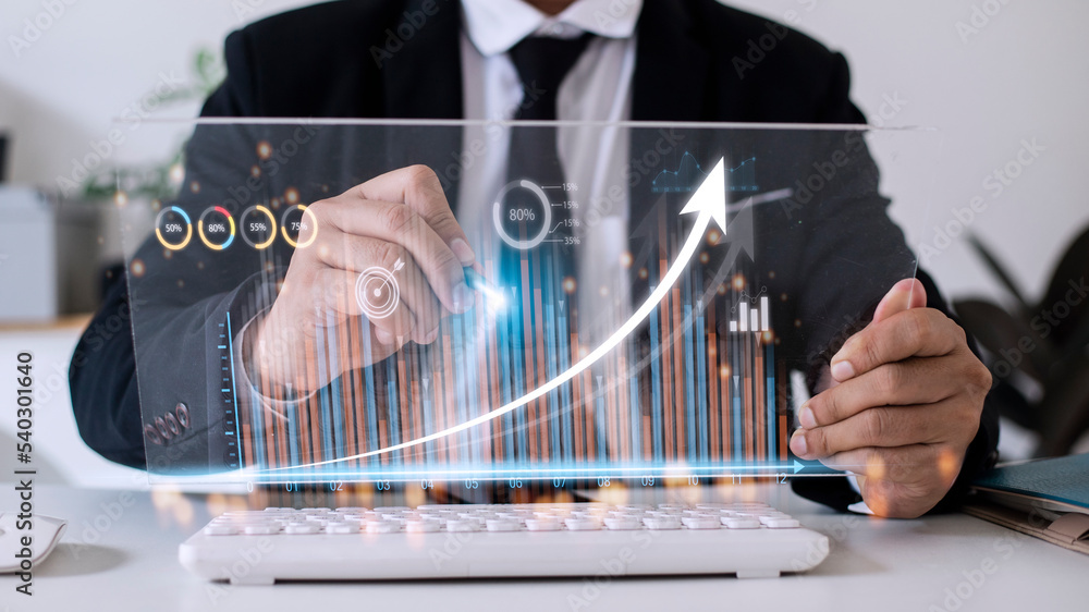 Poster people using tablets and using his finger to touch the screen with a business graph showing up in a 