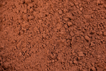 cocoa powder in a bowl shot on a macro lens, powder for making chocolate.