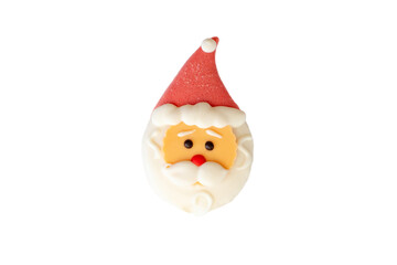 A sweet dessert in the form of a Santa Claus head, with a red cap, isolated