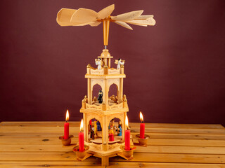 Christmas pyramid. Christmas carols, singers in the form of wooden figures.