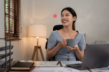 Asian woman working with laptop at home. work from home concept