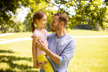 Fototapeta premium Father with daughter having fun at the park