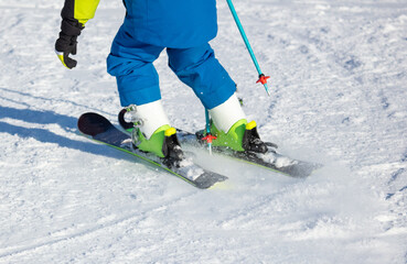Fototapeta na wymiar A man is skiing in the snow.