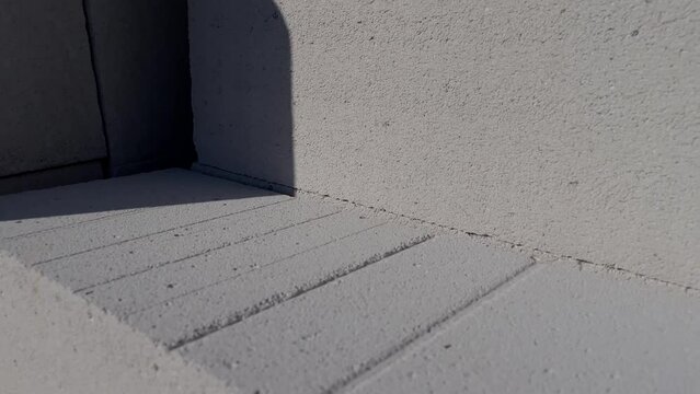 The gas block is at a construction site. Slow motion video with gas block pallet