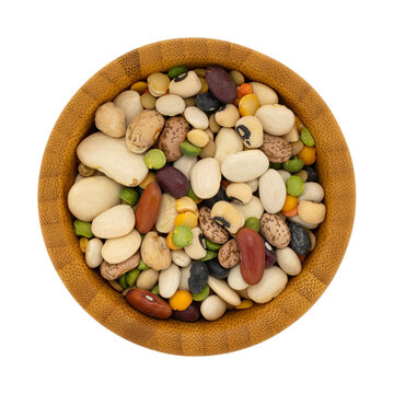 Top view of 13 bean soup ingredients in a wood isolated on a white background.