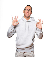 Fototapeta premium Surprised young man with a gesture of approval