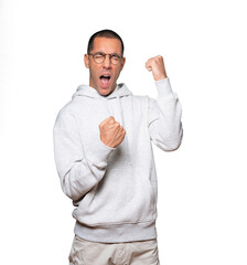 Competitive young man making a gesture of celebration