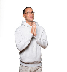 Concerned young man praying gesture