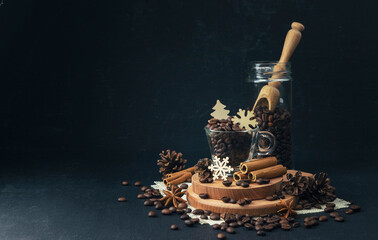 Spiced coffee. Winter hot drink. Christmas. Roasted Coffee beans on dark black  background. Coffee concept. Mock up.