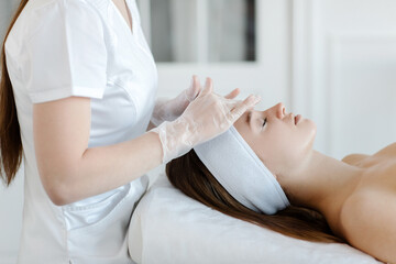 Close up of cosmetologist do beauty face procedures or treatment to woman client in aesthetic medicine clinic. Cosmetology concept. High quality photo