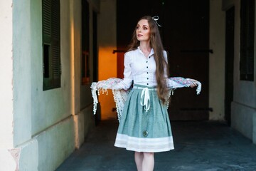 Young Caucasian girl with long hair and a ribbon bow on her head