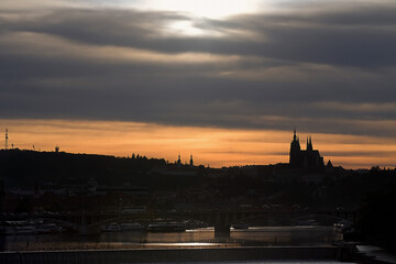 Obraz premium Prague sunset silhouette on background of dramatic cloudy sky