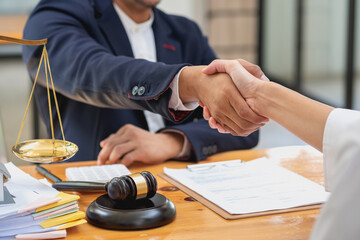Law, Counsel, Agreement, Contract, Lawyer, advising on litigation matters and shaking hands in...