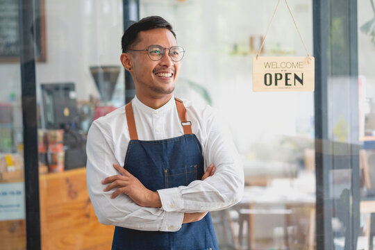 Portrait Of A Man, A Coffee Shop Business Owner Who Is Smiling Beautifully And Opening A Coffee Shop That Is Her Own Business, SME Concept.