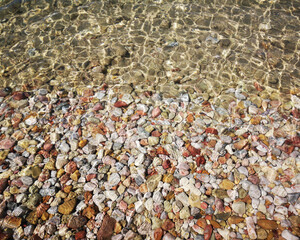 Pebbles and sea water, beach view