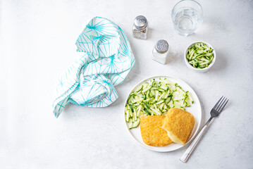 Cordon blue with cheese and cucumber salad