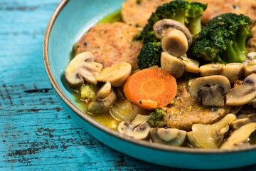 Eid Mubarak Traditional Ramadan Iftar dinner. Assorted tasty food in authentic rustic dishes on wooden blue background. Turkish Bosnian food meat kebab, pita, Sarma, klepe, sogan dolma.