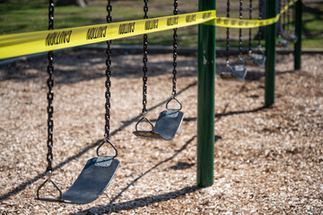 A school playground in Michigan is sealed off with yellow tape during COVID-19 lockdown.