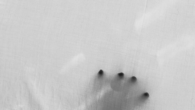 eerie blurry hands of people, ghost as if they have been trapped behind glass, fabric, wrap, spirit trying to reach out from afterlife, concept of violence, nightmares, halloween horror, friday 13th