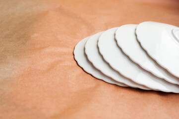 steps from white porcelain plates. copy space. selective focus