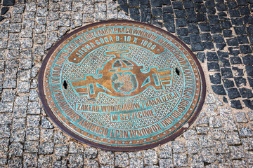 Decorative manhole cover in in Jasna Gora, Czestochowa, Poland