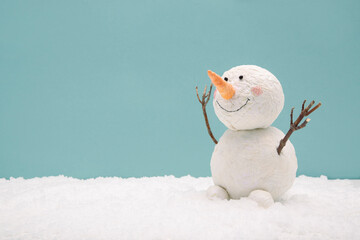 funny snowman on a turquoise background - obrazy, fototapety, plakaty