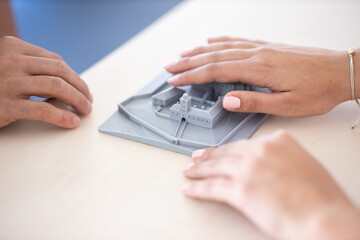 People with impaired vision using tactile maps, 3D models of town centres, landmarks, streets