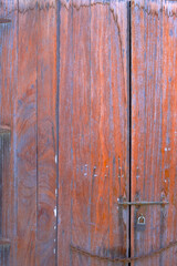 Old ancient medieval wooden door. Old wood / timber texture. Rusty iron finish.