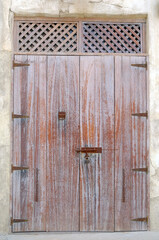 Old ancient medieval wooden door. Old wood / timber texture. Rusty iron finish.