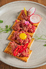 tapas with beef tartare and yolk