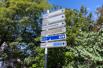 Directions signpost with foliage in the background in Sintra