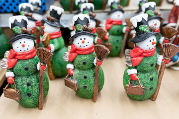 Souvenir snowmen at Christmas market. Creating festive atmosphere, gift, festive decorations for Christmas and New Year